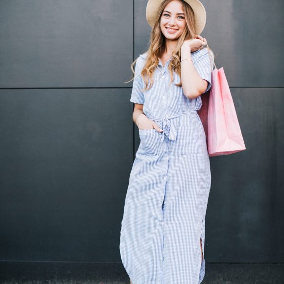 trendy-model-posing-contently-with-buying